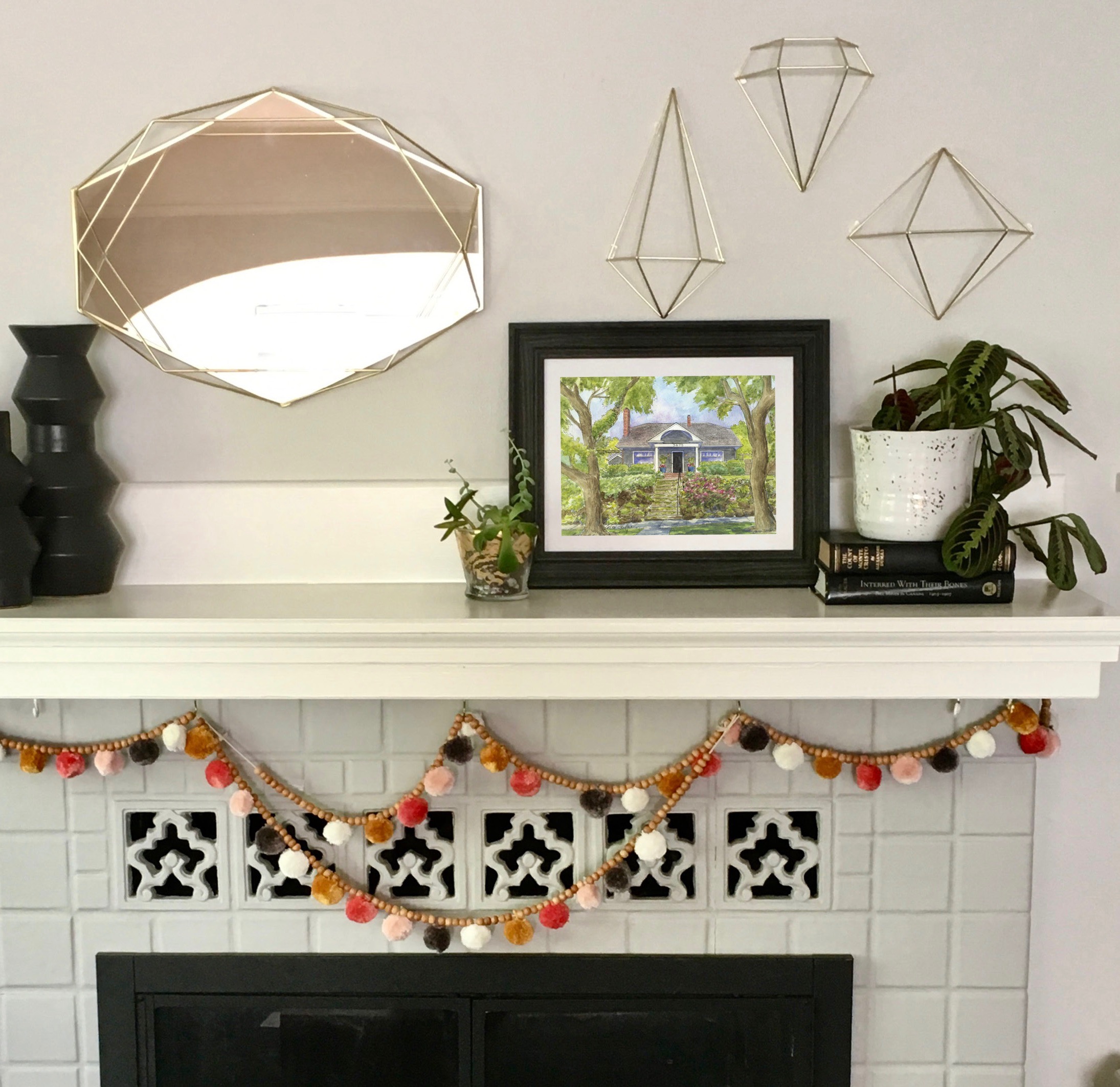 My client Erin sent me this photo. The original portrait of her cute Portland bungalow sits artfully above the fire place. 