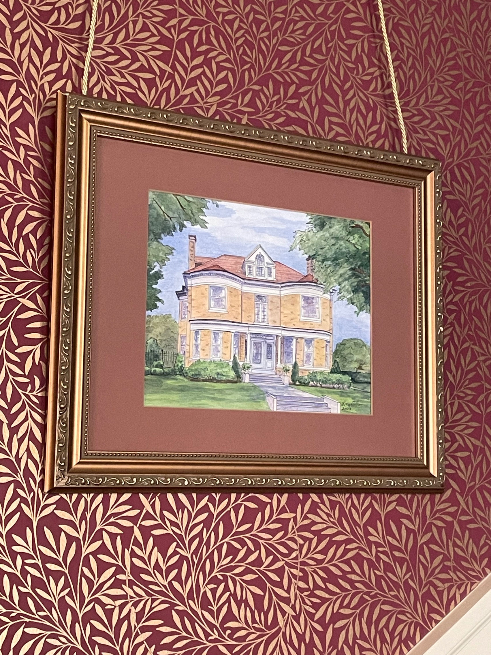 My client Gerry in St. Louis MO added class and elegance with this framing and placement of his house portrait painting.