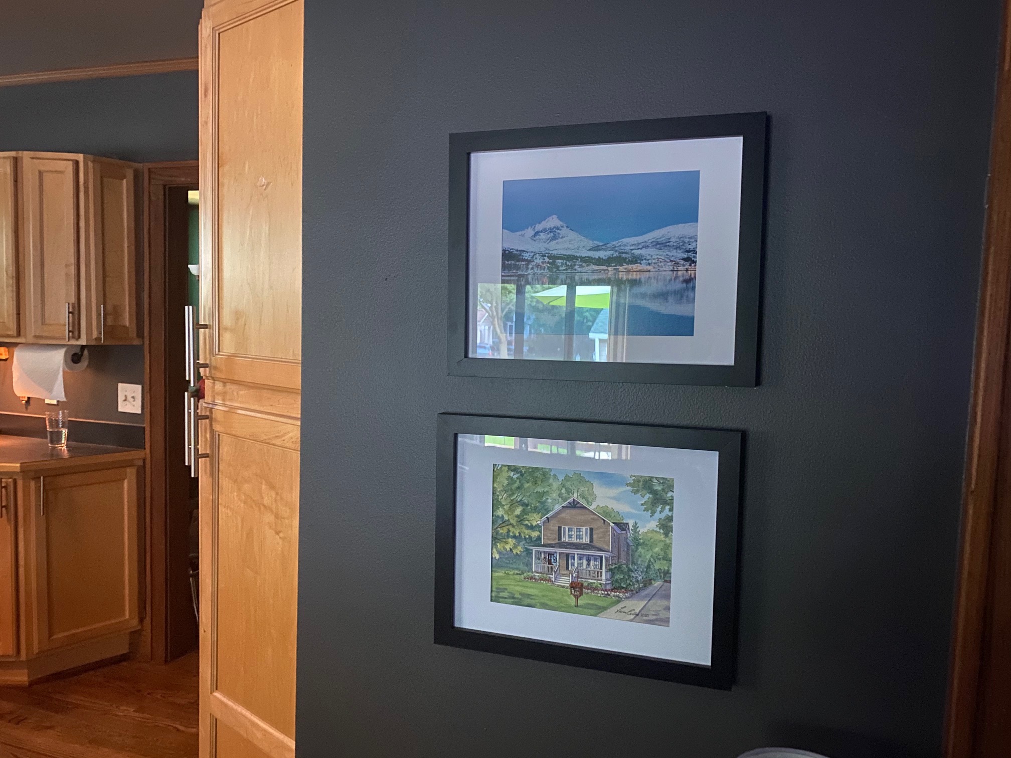 My client Steve in Royal Oak MI displays his house portrait at the entrance to the kitchen