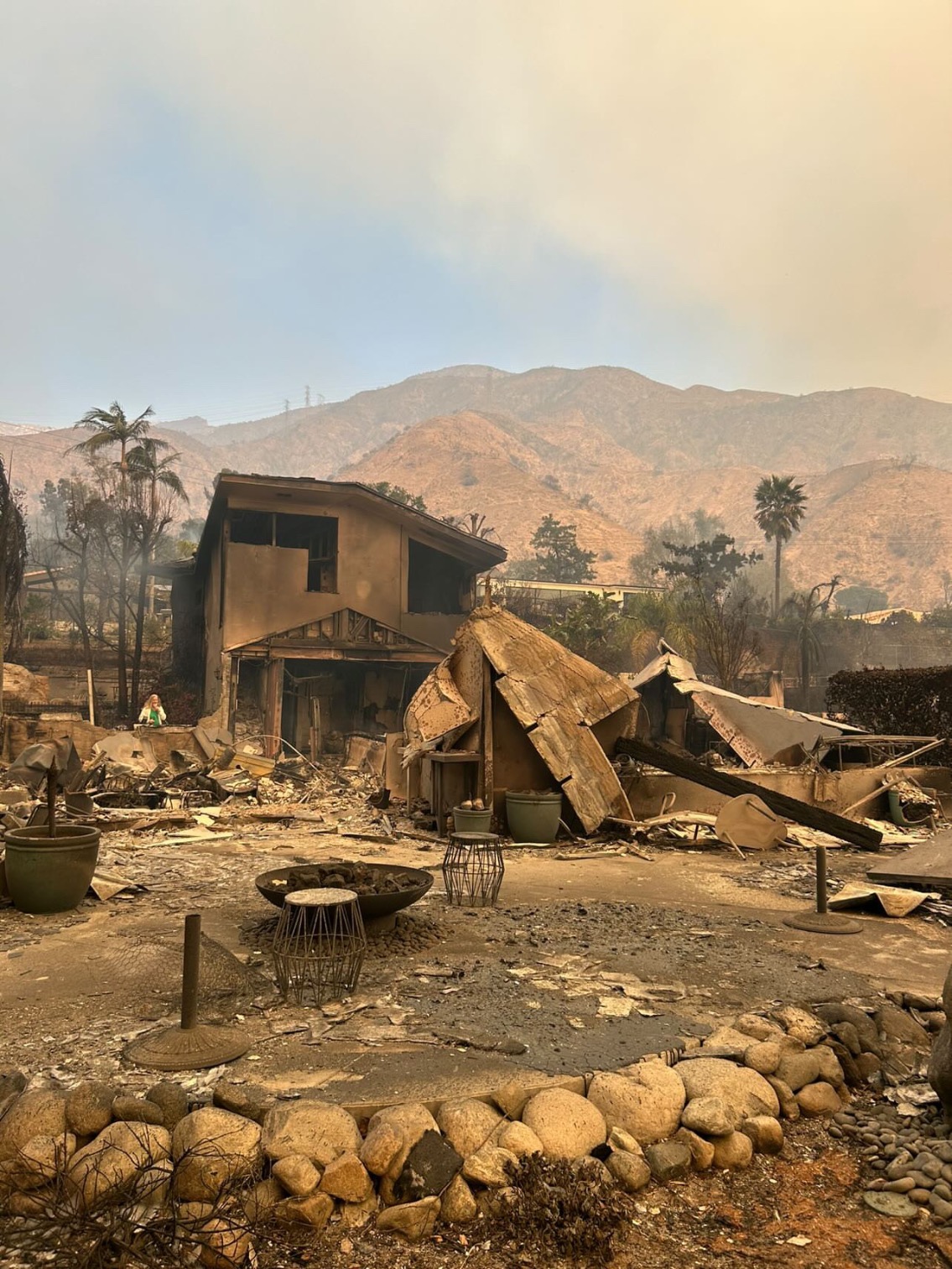 The fire-charred remains of this Altadena home
