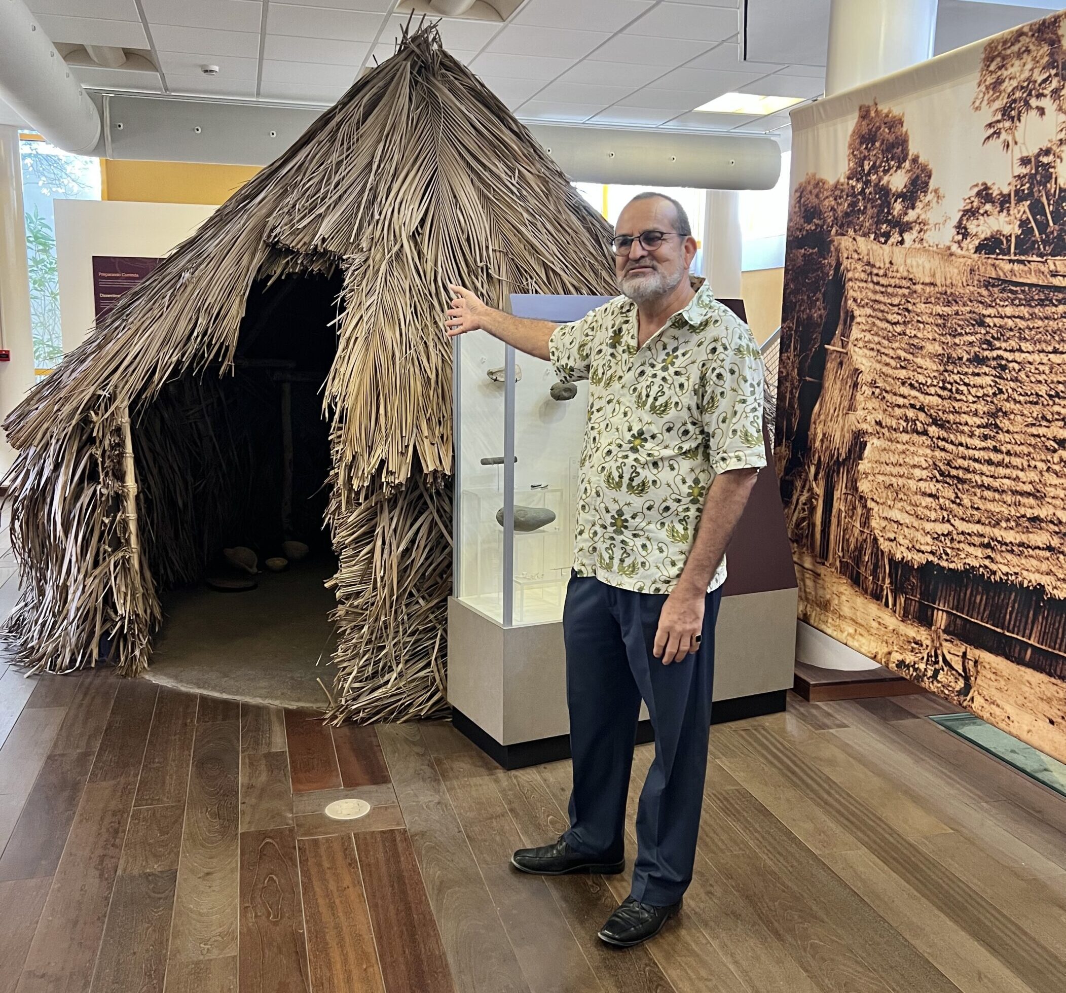 Mr. Geerman, Director of the Aruba Archaeological Museum showing a typical dwelling of indigenous people in Aruba