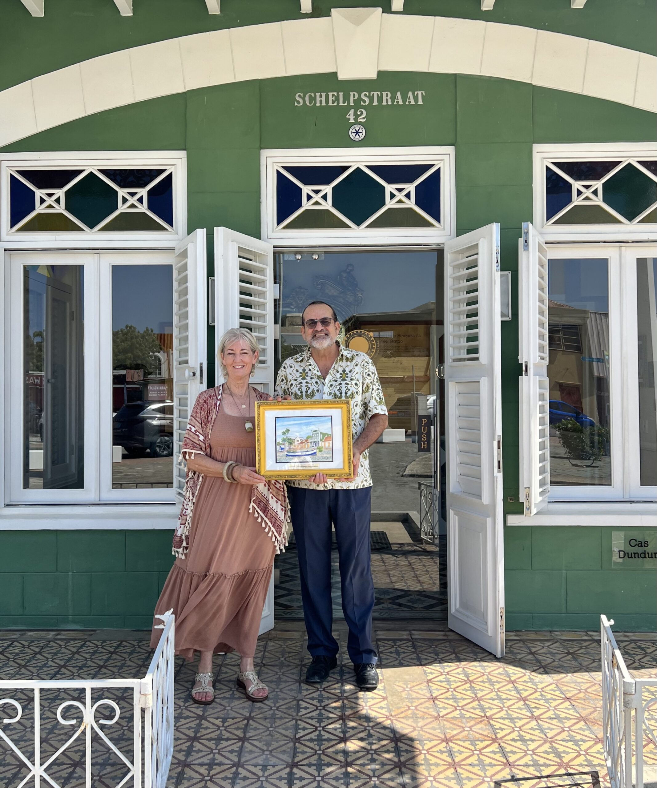 Presenting the award to Pancho Geerman, Director of the National Archaeological Museum of Aruba in the capital city of Oranjestad.